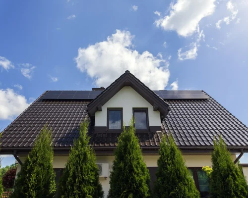 suburban-home-exterior-with-blue-sky-and-clouds-2026-03-18-04-26-17-utc